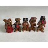 A five piece wooden carved dog band.