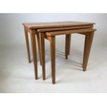 A mid 20th century blonde nest of tables. Stamped St.Dunstans, War Blinded Man. W:60cm x D:40cm x