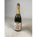 An unopened bottle of Brut Champagne reserved for Roy Savage. Selected and imported by Alexander &