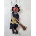 Early Pelham puppet in blue-label box. Witch on broomstick with wooden peg teeth and drop lead