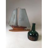 A mid century wooden ship styled light with vintage cherry brandy bottle W:35cm x H:37cm Ship