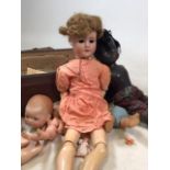 An Armand Marseille bisque porcelain doll together with and Armand Marseille bisque dolls head and