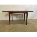 A mid century teak extending dining table by Vesper furniture. W:148cm x D:81cm x H:75cm