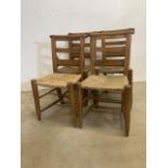 Four pine rattan school chairs with book slide to the back. W:44cm x D:38cm x H:83cm