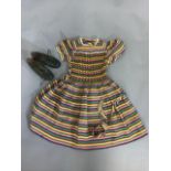 A hand smoked Lewcon dress size 30 inches and a pair of 1950s girls shoes size 11