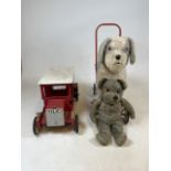 A Triang dog walker together with a a mohair teddy bear and wooden police car in red.