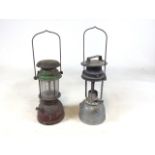 Two vintage gas lamps. The green lamp with the mark Bialaddin, made in England. Glass cracked to one