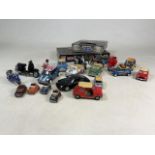 A collection of interactive Mini Coopers model cars, model scooters and a Stars Wars board games.