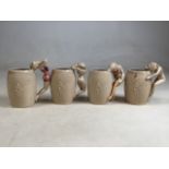 A set of four Japanese mugs with semi naked lady handles. H:14cm