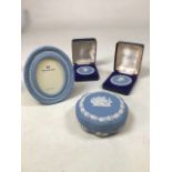 Wedgwood jasperware items to include two boxes medallions, a photo frame and a trinket pot