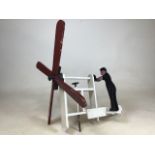 A wooden folk art style windmill automaton. Approx W:50cm x H:50cm