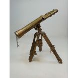 A 20th century brass astronomical and terrestrial telescope on tripod stand with adjustable base. 43