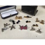 A selection of unmarked white and yellow metal cuff links some aviation(Spitfire) related and a