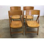 A set of four Dutch mid century folding chairs by Van Rooijen with labels to back. N.V. Stoel- en