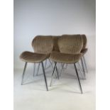 A set of four modern upholstered chairs on chrome legs.