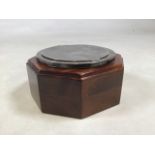 An Edwardian sterling silver desk top cigarette box with hexagonal mahogany mount by William
