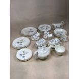 A Wedgwood Ice Rose dinner service with tea pot, tea and coffee cans. To include five dinner plates,
