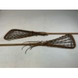 Two Vintage Lacrosse Sticks. H:110cm