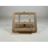 A pine portable easel and paint box. W:34cm x D:5cm x H:24cm