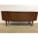 A mid century sideboard by Stonehill furniture double centra doors to interior gilt bound shelf