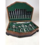 An oak canteen of silver plated Sheffield cutlery. W:54cm x D:36cm