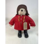 A Gabrielle Designs Paddington Bear in a red felt jacket and brown felt hat, 1972