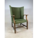 A 1930s small wing back or tub chair with original green upholstery.W:64cm x D:54cm x H:
