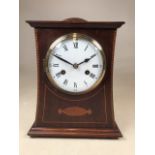 A late 19th early 20th century inlaid mahogany mantle clock with stamped movement by PHS Philipp
