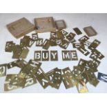 A large quantity of brass letter and number stencils. Letter size approximately W:4cm x H:5.5cm