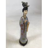 A 20TH CENTURY CHINESE CLOISONNE FIGURE, modelled as a standing female, with simulated ivory face