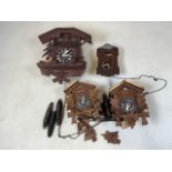 Various cookoo clocks and weights.W:24cm x H:30cm