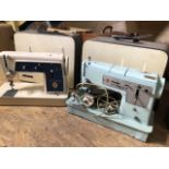 A singer sewing machine model 348 together with a singer 656g - no pedal.