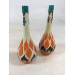 A pair of Arabian Arcadian Ware vases designed by Frederick Rhead with hand painted Art Deco