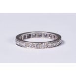 A 9ct white gold and diamond full eternity ring. 2.5g. Size n.