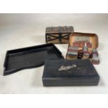 A silver lettered ebony cased manicure part set also with a tray and a leather cased travel set also