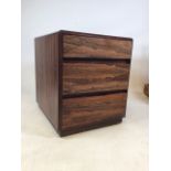 A rosewood veneer bedside chest of drawers. W:48cm x D:59cm x H:58cm