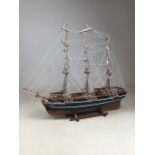 A model of a ship on stand.W:66cm x D:14cm x H:55cm