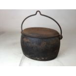 A gypsie A Kenrick and sons three gallon cast iron cooking pot. W:38cm x D:26cm x H:21cm