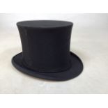 A Lincoln Bennett and Co collapsible top hat.