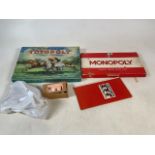 A collection of board games to include Totopoly racing game, Monopoly and Boxwood chessman and