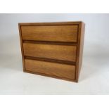 A beechwood three draw bedside table W:52cm x D:43cm x H:46cm