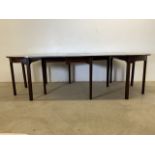 A Victorian mahogany extending dining table with four brass clips. W:259cm x D:117cm x H:72cm