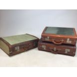 Three leather bound canvas suitcases. Smallest W:53cm x D:38cm x H:20cm