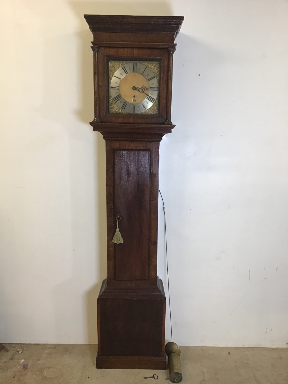 A late 19th century mahogany long case clock silvered chapter and gilt face with gilt spandrels