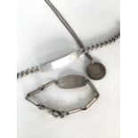 Two sterling Silver identity bracelets together with a sterling silver pendant on chain.