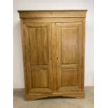 Modern oak double wardrobe wardrobe with interior shelves and hanging rails with later mirror to