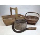 A flower trug with a smaller example a sieve also with a hand scythe. W:46cm x D:33cm x H:30cm