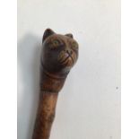 A cats head walking cane with steel tip H:92cm
