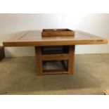 A square hardwood table by Margaret Muir with centre tray and shelf underneath also with two
