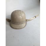 A vintage Everoak peaked motor cycle helmet with chin strap.